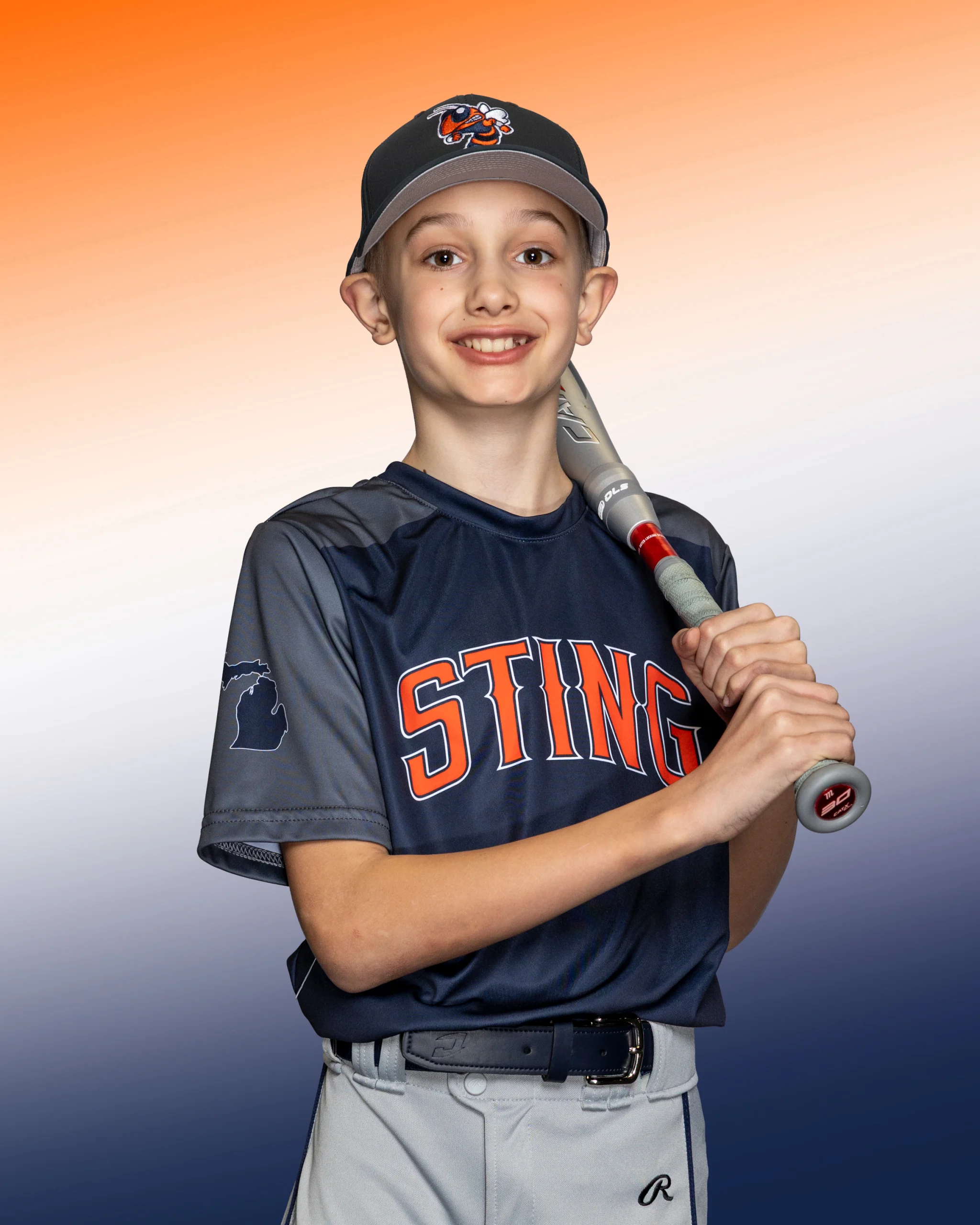 Brant Oberst standing proudly with bat over shoulder in his Sting uniform